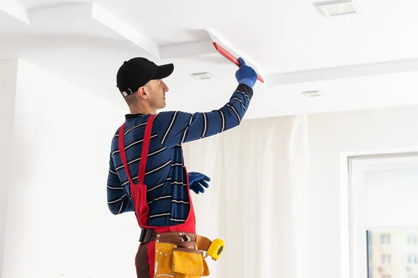 depositphotos_653061992-stock-photo-construction-worker-installation-ceiling-work